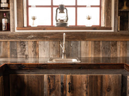 Rustic kitchen sink with reclaimed redwood 1x8 backsplash and cabinets